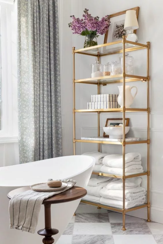 Gold shelves in bathroom