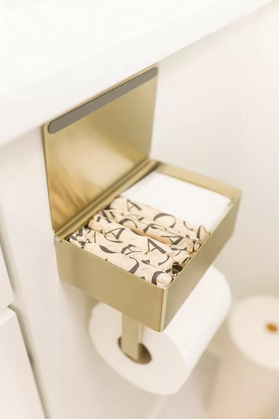 Gold toilet paper holder with storage space