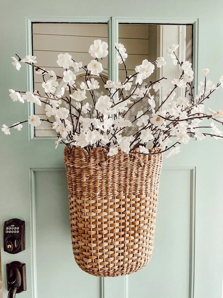 Basket of spring branches on front door